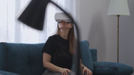 female-student-is-using-modern-technology-of-head-mounted-display-at-home-device-for-game-and-education-HMD-and-VR-headset